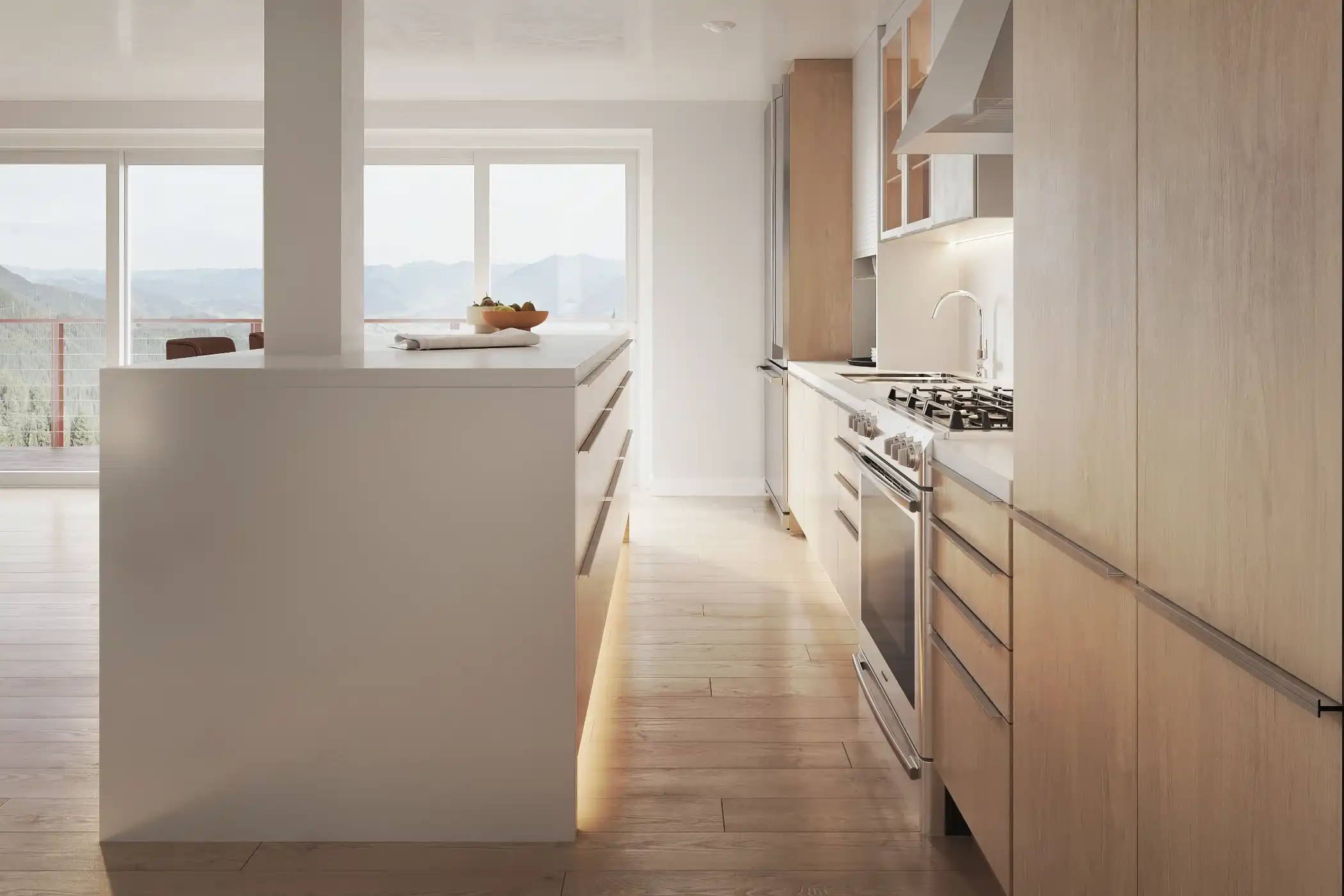 This bright kitchen features integrated handles within white and light wood cabinetry, highlighting the clean and modern design. The galley layout maximizes space, with ample storage and a functional work area. Large windows bring in natural light, further enhancing the airy and open feel of the space. The combination of light finishes and integrated handles creates a sleek and uncluttered look.