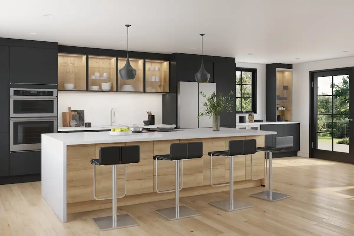 A modern FORM kitchen with a large island and bank of units running along the rear wall. The finishes are Sierra Oak Reproduction and Graphite Black Matt. The lighting is Tom Dixon and the atmosphere is high contrast and elegant.
