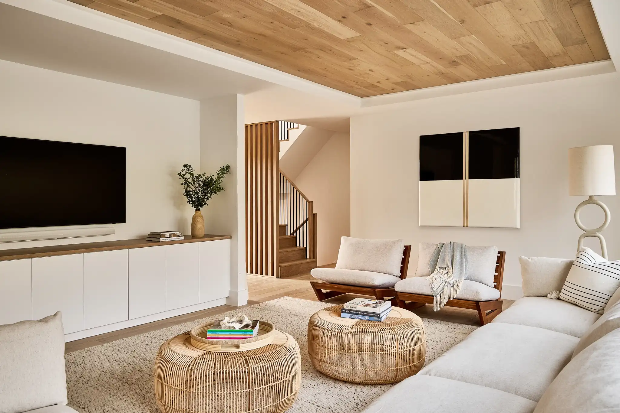 Cozy and inviting living room space featuring natural wood cabinetry.