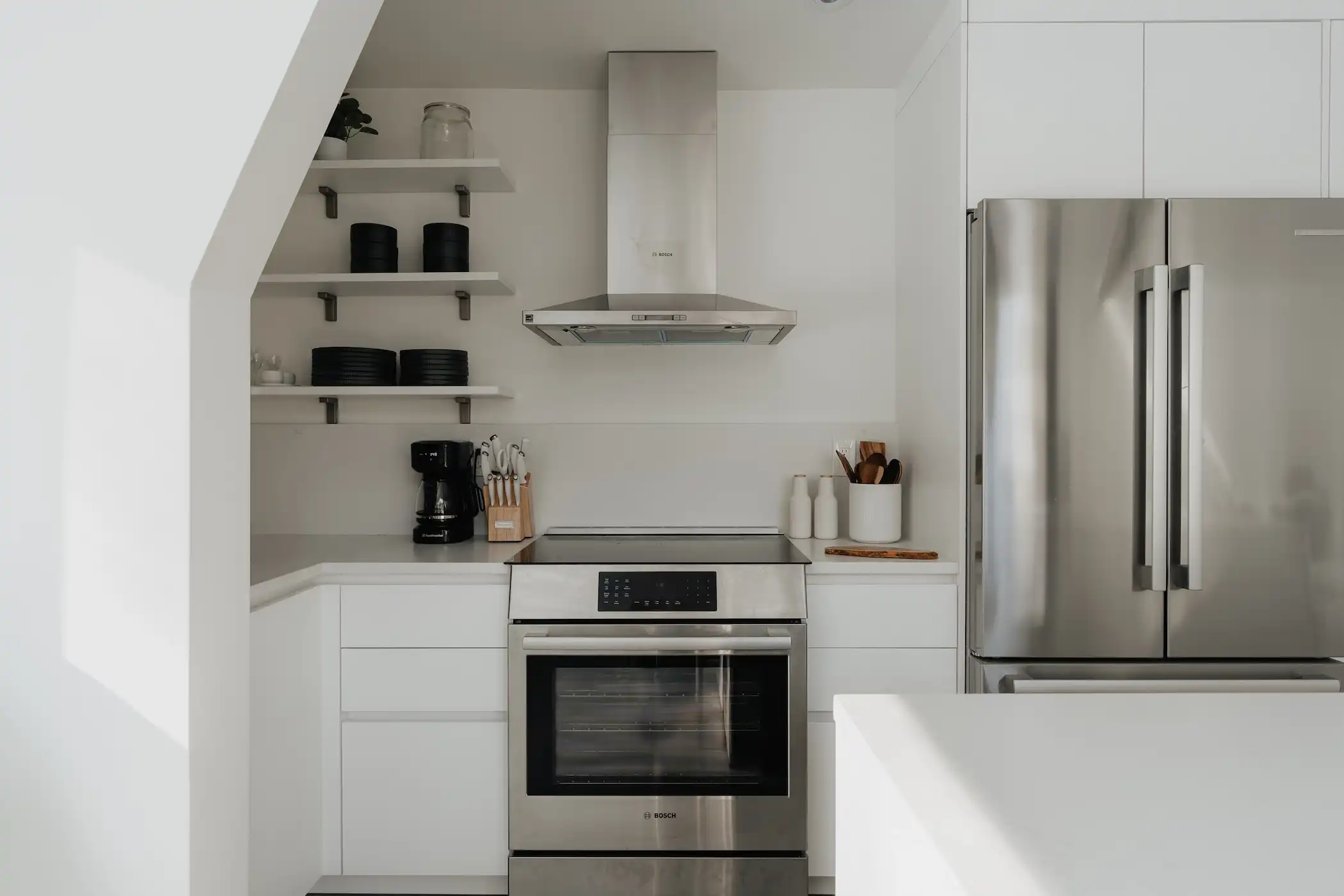 Built-in shelves stocked with kitchen essentials.